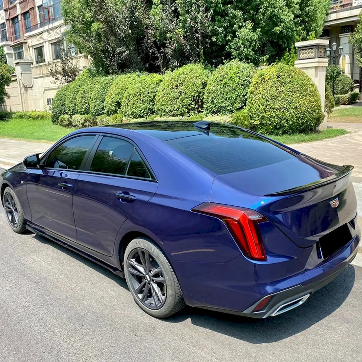 sedan wrapped in metallic gentian blue car wrap