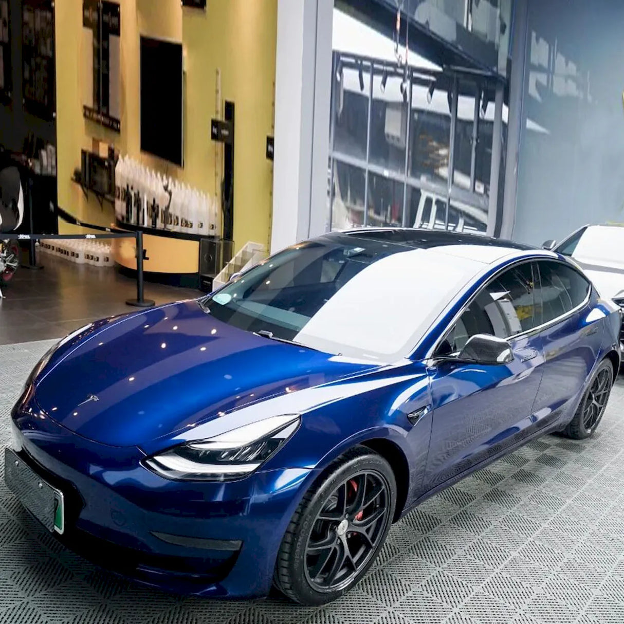 tesla wrapped in metallic gentian blue car wrap