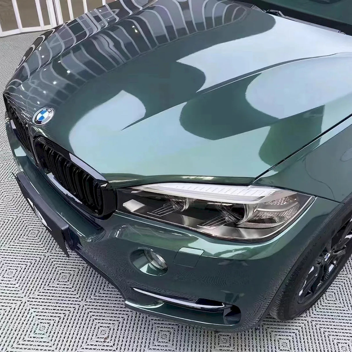 suv wrapped in metallic gothic green vinyl car wrap