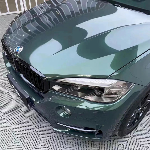 suv wrapped in metallic gothic green vinyl car wrap