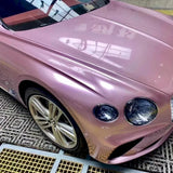 metallic passion pink wrap on a luxury car