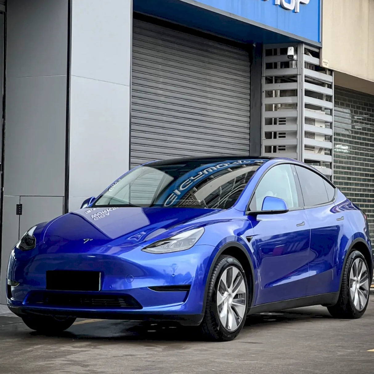 car wrapped in metallic portimand blue car vinyl wrap