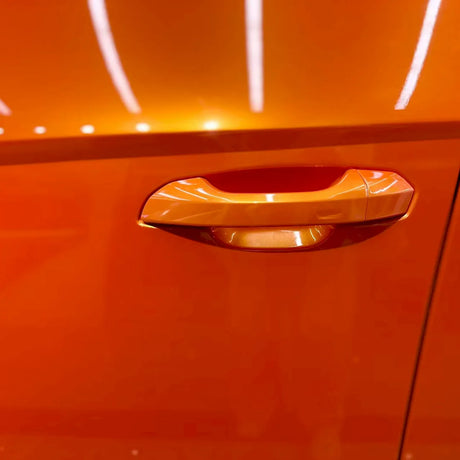 metallic racing golden orange car vinyl wrap installed on a vehicle