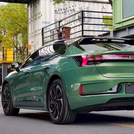 car wrapped in metallic rainbow green car vinyl wrap