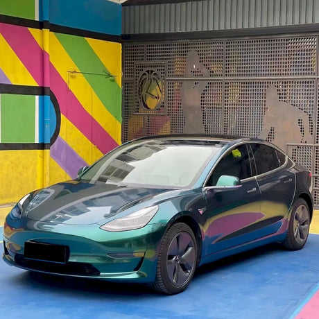 tesla wrapped in metallic royal green car wrap