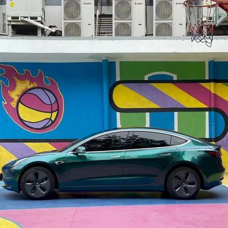 side shot of an EV car wrapped in metallic royal green car wrap