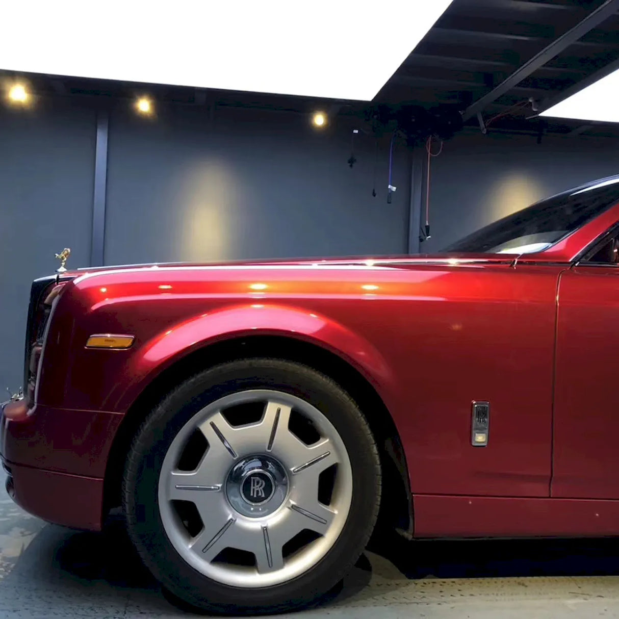 large sedan wrapped in metallic soul red car wrap