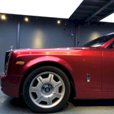 large sedan wrapped in metallic soul red car wrap