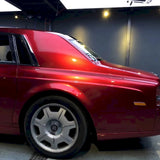 luxury vehicle wrapped in metallic soul red vinyl wrap