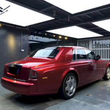 large vehicle wrapped in metallic soul red car vinyl wrap