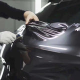 installation of space gray gloss car wrap