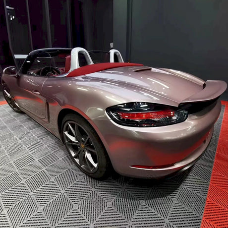 sports car wrapped in metallic strawberry pink wrap