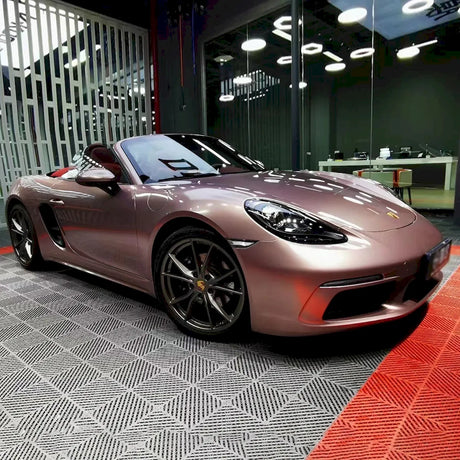 porsche boxter wrapped in metallic strawberry pink vinyl wrap