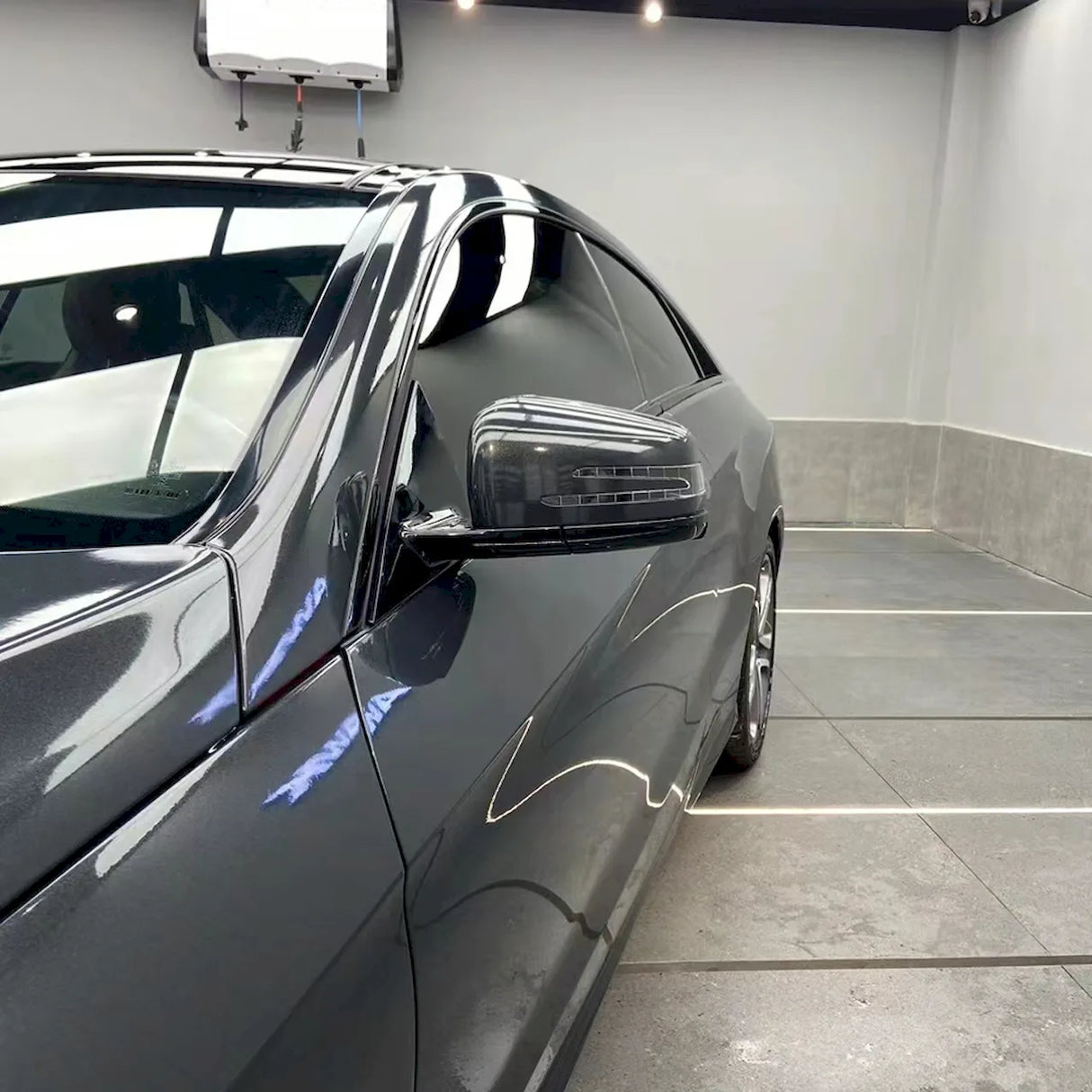 metallic volcano gray car wrap being installed