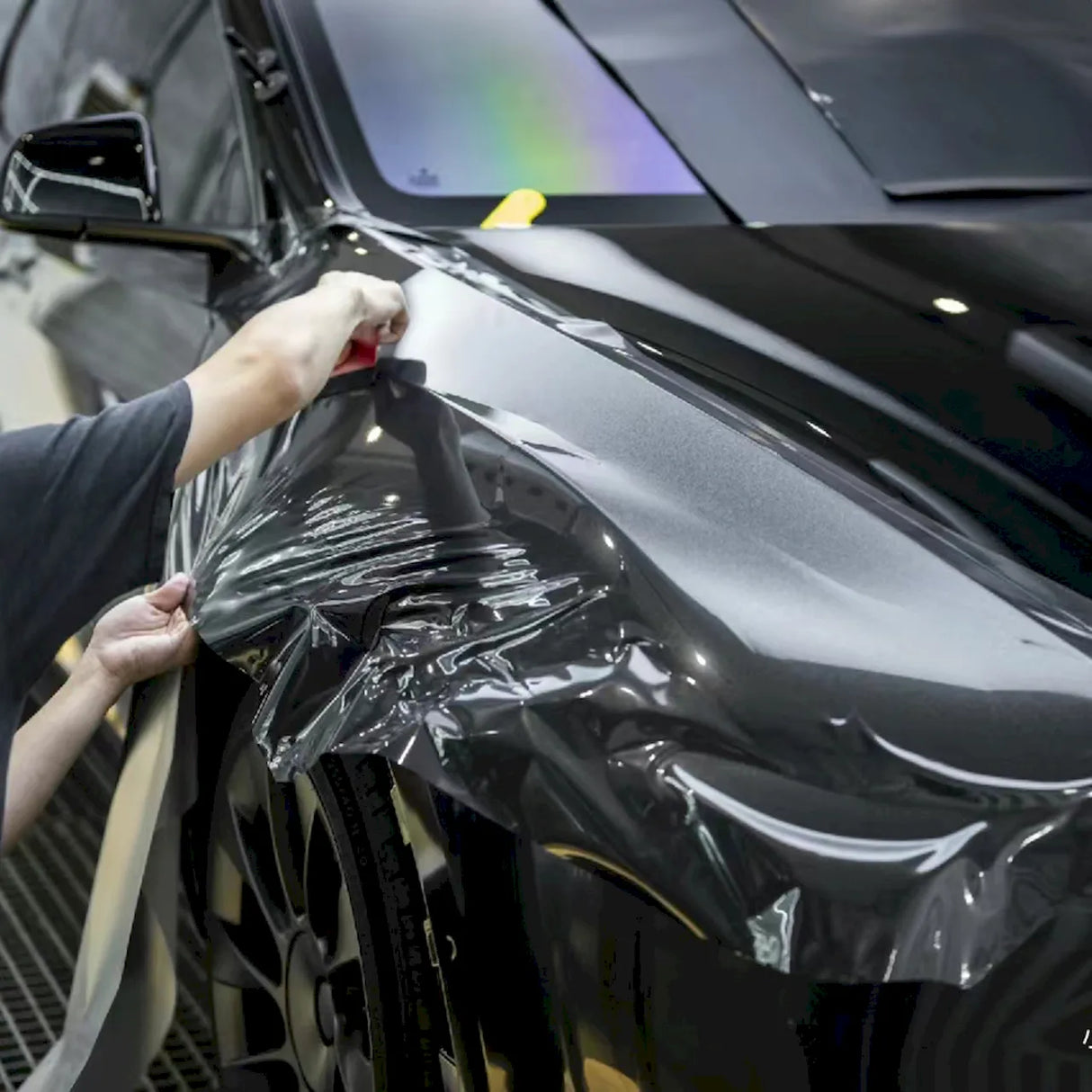 car getting wrapped in metallic volcano gray car wrap