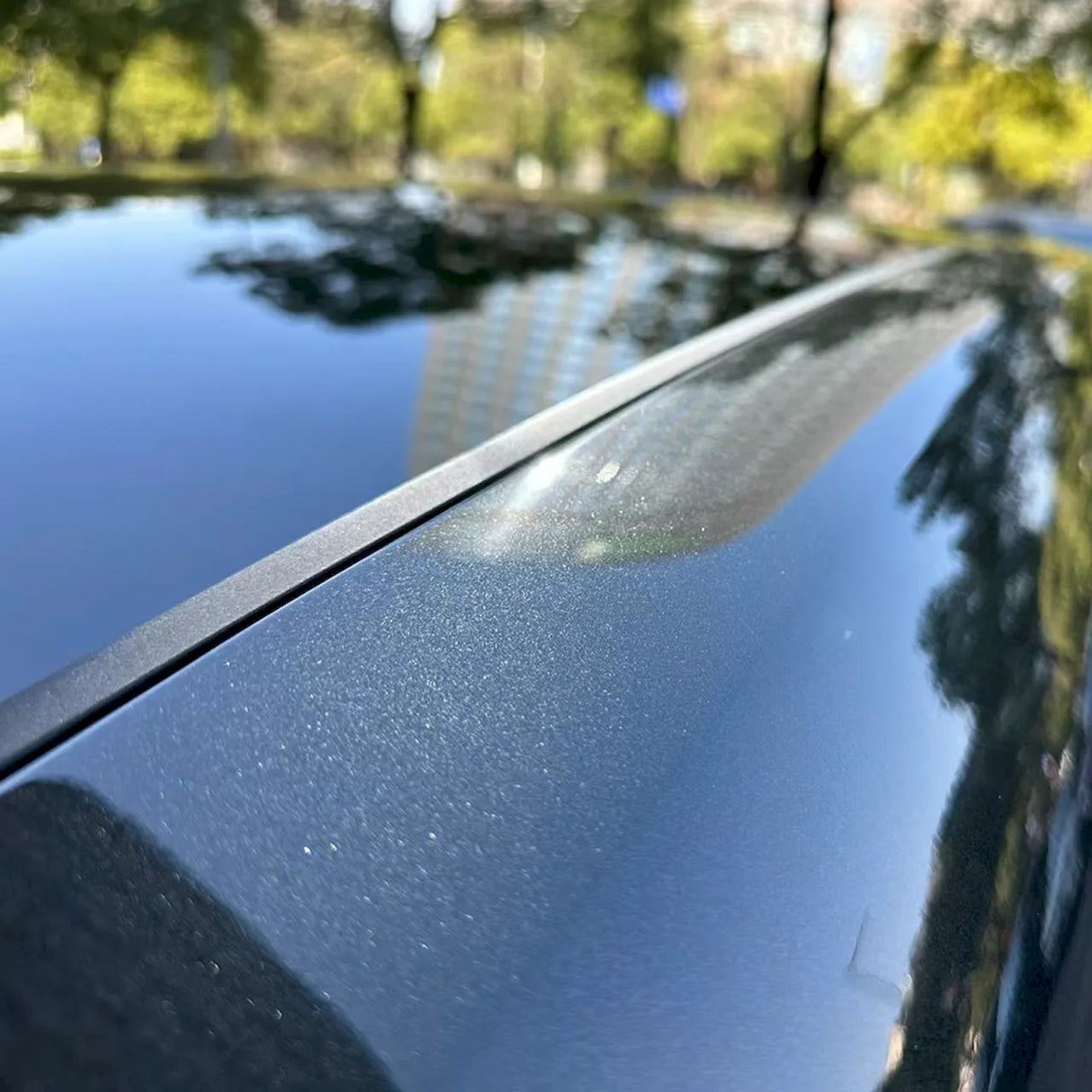 metallic volcano gray car wrap under the sun light