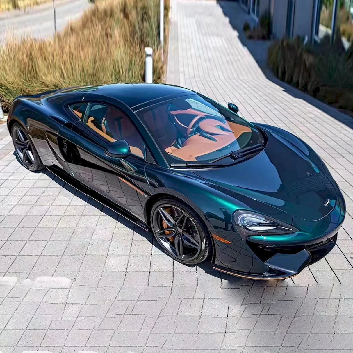 midnight green car wrap installed on a sports car