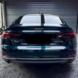midnight green car wrap installed on a sedan