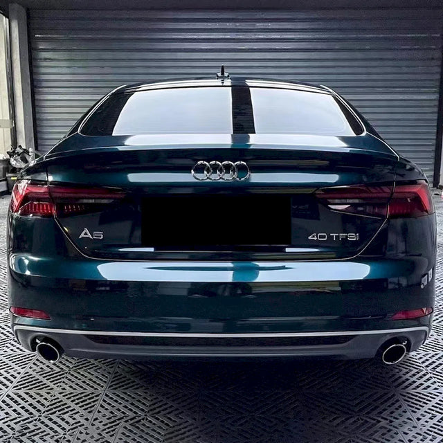 midnight green car wrap installed on a sedan