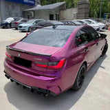 pearl purple gloss car wrap installed on a sedan