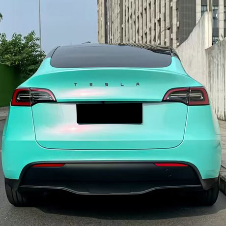 car wrapped in racing aqua green blue car wrap