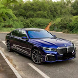 royal indigo blue gloss car wrap on a large sedan