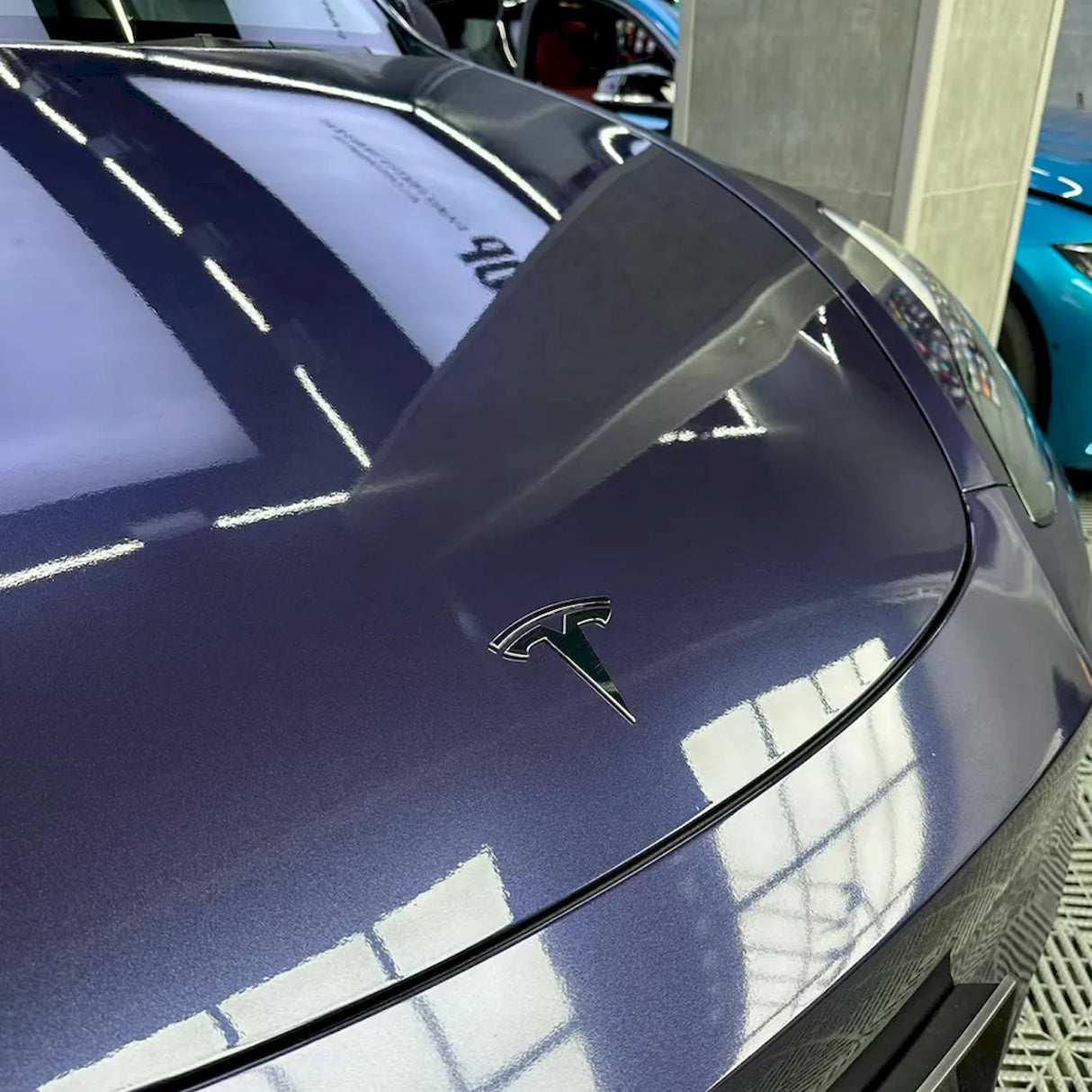 sapphire blue car wrap installed on a car
