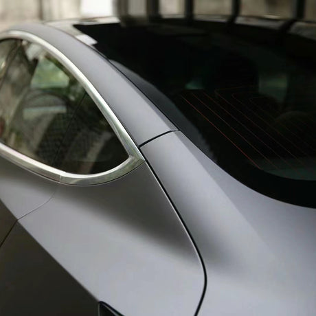 ultra matte dark grey car wrap on a corner of the car
