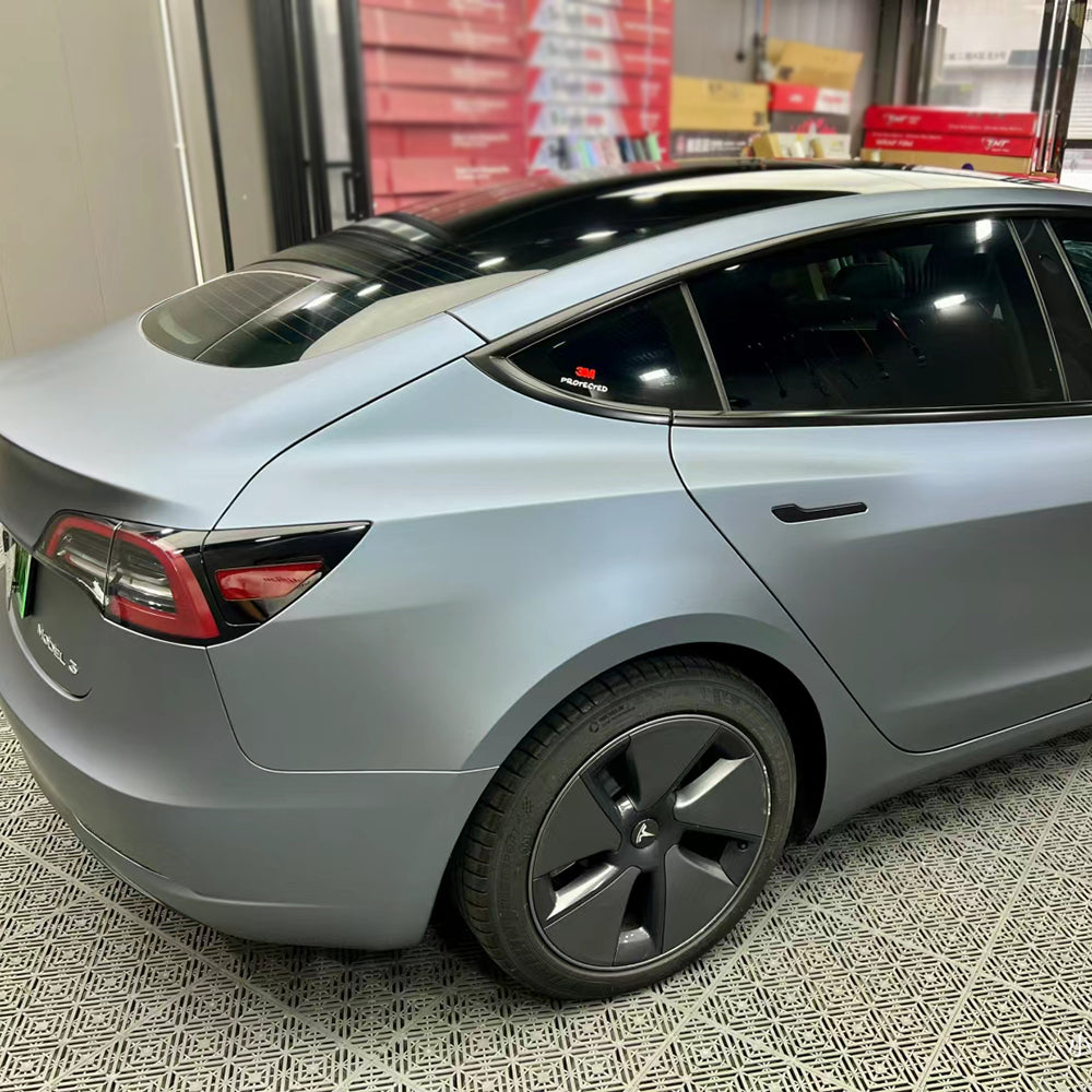 ultra matte blue gray car wrap being installed