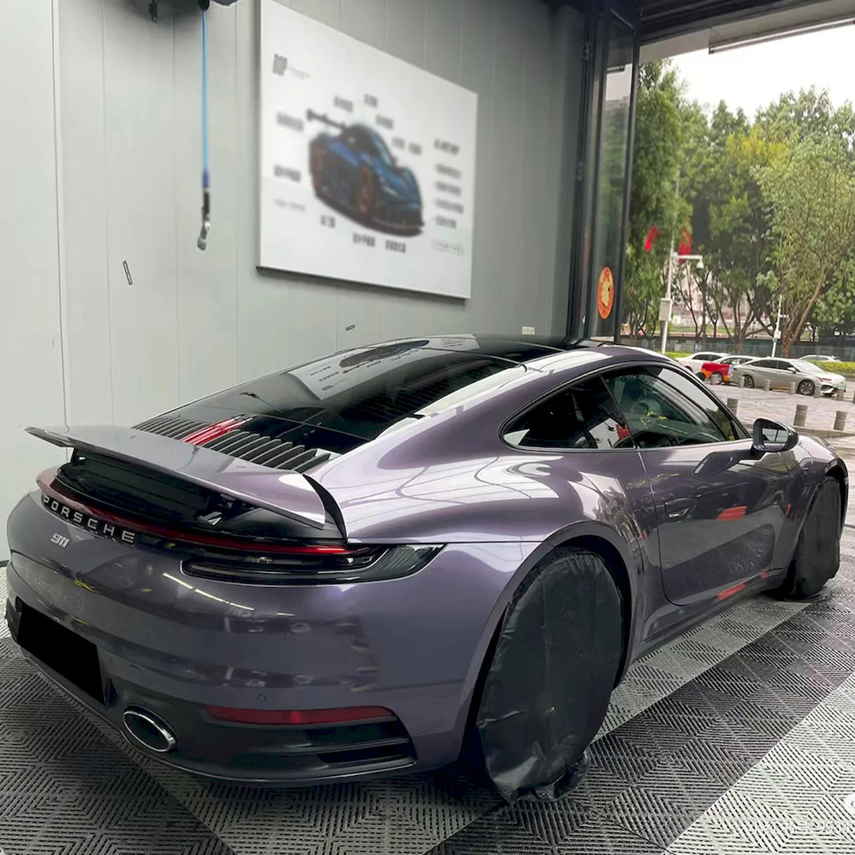 violet gray gloss purple car wrap installed on a sports car