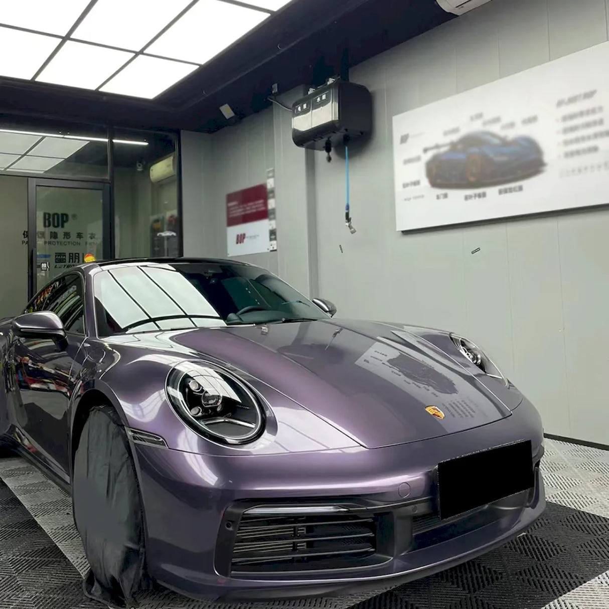 violet gray car wrap being installed